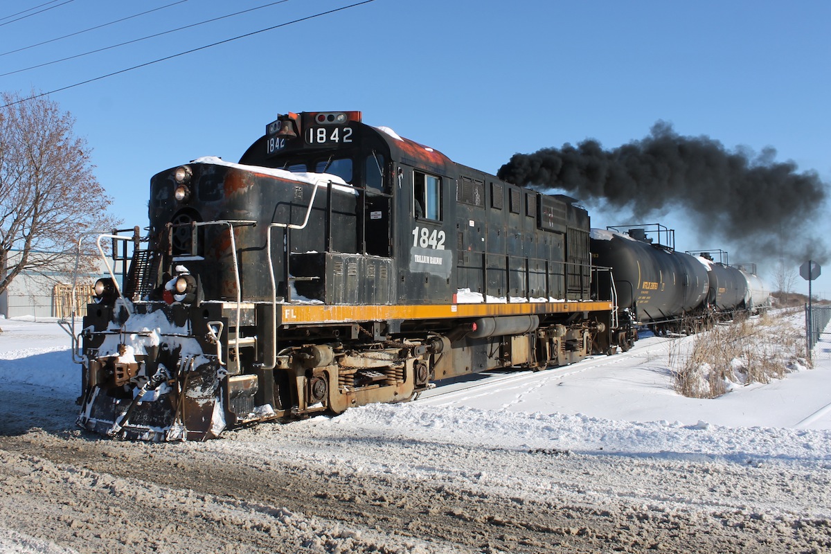 Trillium Railway 1842 throttles up on its way into St.Thomas spewing its iconic thick black ALCO exhaust.
