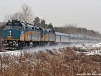 A pair of F40's, VIA 6455 and 6451 lead a 10 car Canadian just north of the siding at Pine Orchard. In reverence to what actually pays the bills, they went into Zephyr for three southbound freights, 412, 112, and 114, met 302 at Pefferlaw, and 104 most likely at Brechin East... and there were another three to meet after 104 - another 114, a 314 and an 874! 1046hrs.