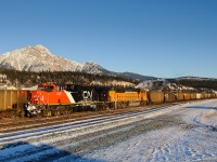CN ES44DC 2257 and BNSF SD70MAC 8935 climb into Jasper with PRB coal loads for export at Prince Rupert, BC. Pyramid Mountain stands tall in the background on this clear, frigid -34C morning. CP/BNSF runthrough power is starting to become more common on these trains. In the past month or so, CP 9555, CP 8729, BNSF 8935, UP 9404 and CEFX 1031 to name a few have shown up.