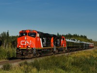 CN ES44DC 2300 and CN SD70M-2 8892 approach the east switch at Gainford, AB with a Board of Directors special. Behind the power was BCOL generator 1710, CN 99, CN 100, IC 800413, IC 800210, CN 1058, CN 1059 and CN 1060.