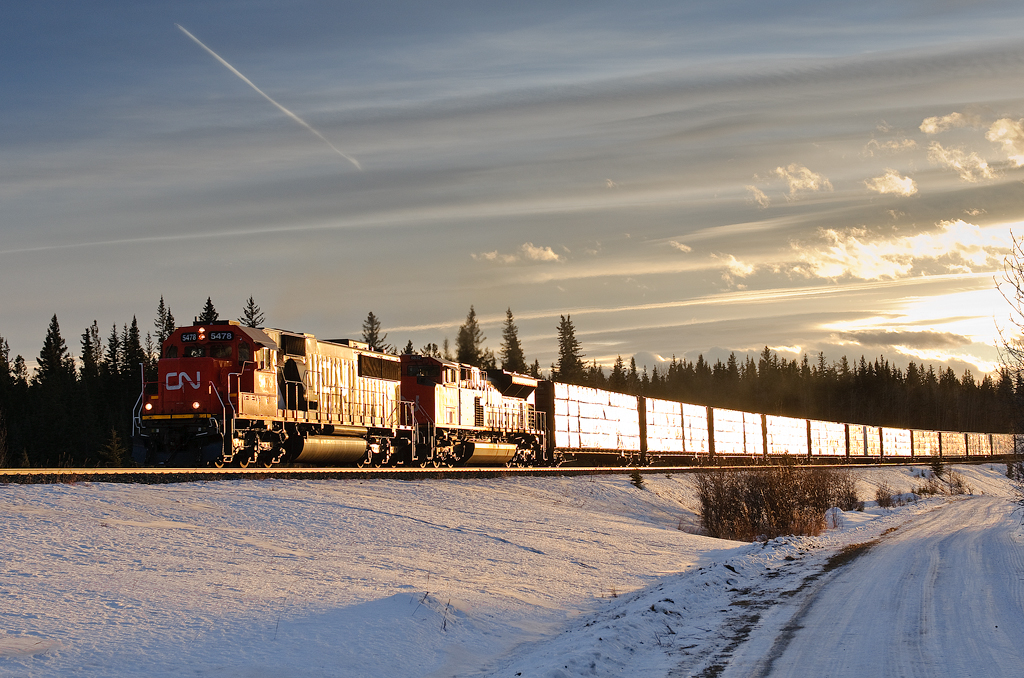 CN SD60 5478 and SD70M-2 8832 climb through Pedley, AB with 8971' of M348 as the sun casts its final (and only rays) of the day.