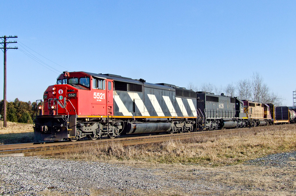 Toronto, ON - UP Salem, IL train M39931 04 prepares to slam across CP's Windsor Sub at Melrose behind a wild consist of CN SD60F 5521, IC SD40-2 6128 and WC GP40-2 3026 (in the Wisconsin map scheme).