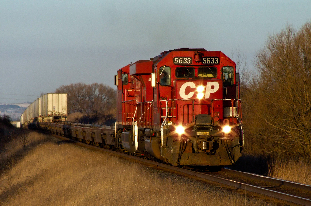 CP SD40-2 5633 and ES44AC 8713 lift eXpressway train 121-21 out of Bowmanville, Ontario speeding west on the Belleville Sub.