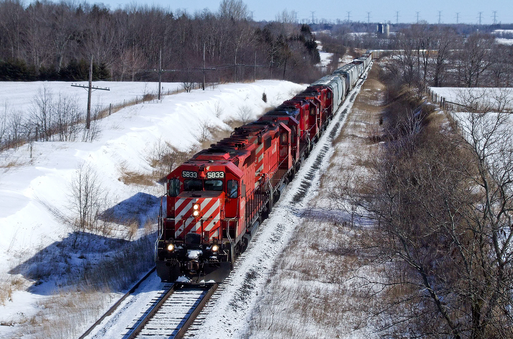 CP SD40-2s 5833, 6035, 5662, GP38-2 3031 and SD40-2s 5674 and 6034 hustle St Luc-Toronto train 235-24 west between Port Hope and Lovekin on CP's Belleville Subdivision.
