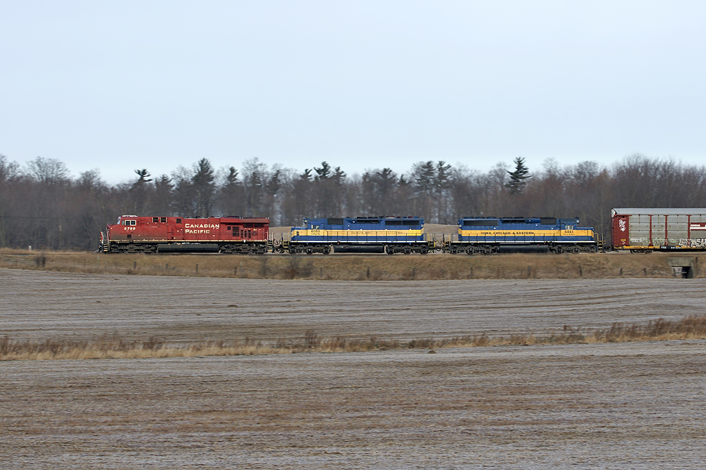CP 8799 with DME SD40-2's 6050 and 6443 head west for Galt.