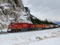 FPAB. While all of you guys in Ontario are enjoying your FPON, we're starting to get some foreign power out west on the coal trains from the BNSF originating in the Powder River Basin. Today's train featured CP ES44AC 8827 and BNSF ES44AC 6412 on the headend with CP ES44AC 8822 shoving on the rear. Both CP units are currently leased to BNSF, which perhaps eliminated the chance of a solid BNSF consist. On the headend of the 107 coal loads are 54 grain loads from Grande Prairie, AB which were lifted at Swan Landing, 30 miles to the east.