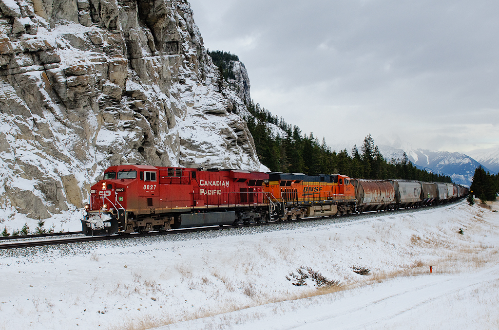 FPAB. While all of you guys in Ontario are enjoying your FPON, we're starting to get some foreign power out west on the coal trains from the BNSF originating in the Powder River Basin. Today's train featured CP ES44AC 8827 and BNSF ES44AC 6412 on the headend with CP ES44AC 8822 shoving on the rear. Both CP units are currently leased to BNSF, which perhaps eliminated the chance of a solid BNSF consist. On the headend of the 107 coal loads are 54 grain loads from Grande Prairie, AB which were lifted at Swan Landing, 30 miles to the east.