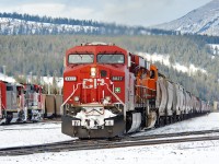 After setting out 3 high-impact (WILD) cars which were detected a few miles east of Jasper, Thunder River Jct, WY-Prince Rupert, BC coal loads depart as CN train C721 behind CP 8827, BNSF 6412 and CP 8822 shoving on the rear.