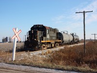 One of the last St. Thomas & Eastern westbound for St. Thomas rolls through farmland just east of Alymer with two cars from Tillsonburg. Old telephone poles still stand tall along the old Canada Air Line rails here. The tracks east of Alymer may not survive the next year with the end of the STER.
