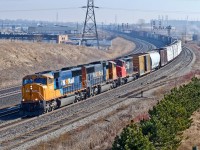 On lease to CN, ONT SD75Is 2105 and 2102 are assisted by CN SD40-2(W) 5294 leading St. John, NB - Toronto MacMillan Yard, ON train M30511 09 westbound at Oshawa West.