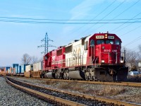 CP Coquitlam-Montreal train 198-12 rockets down the main at CP's Oshawa siding behind SOO SD60s 6041 and 6046.