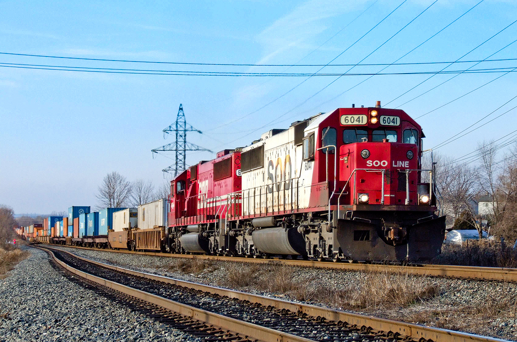 CP Coquitlam-Montreal train 198-12 rockets down the main at CP's Oshawa siding behind SOO SD60s 6041 and 6046.
