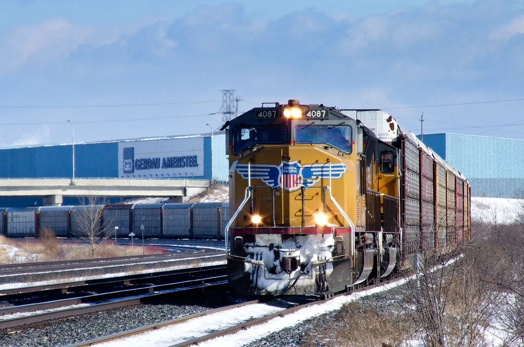 UP SD70Ms 4087 and 4885 ease westward on CN's Whitby Service Track with Oshawa, ON - Gibson, IN train E27931 16. In less than a mile they will accept the light at Whitby and head onto CN's Kingston Sub.