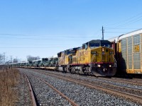 UP C41-8W 9439 and UP SD70M 5109 approach Clarke with UP Salem, IL - Quebec City, PQ military train X35091 09. The military equipment was en route from Fort Bliss, TX heading to Val Cartier, PQ.