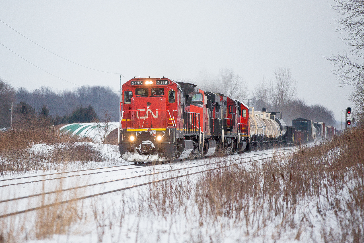 CN 2116 leads CN 2324 CN 2102 and freshly repainted CN 5477 west past Melrose Diamond MP 12.56 Strathroy Sub