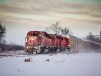 CP 5975 CP 5872 CP 6229 heading west into the sunset with loaded auto racks from the Toyota plant in Woodstock on the CP Windsor Sub MP 15 at Caradoc