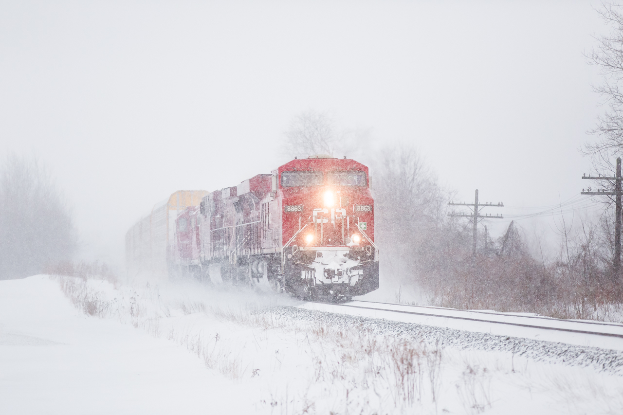 CP 8863 CP 9776 CP 8243 CP 8222 W at Melrose Diamond with 113 cars in a blizzard.