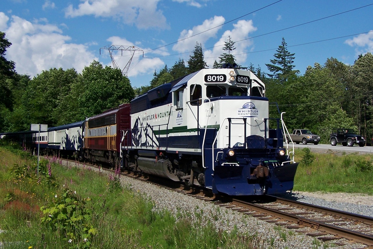 GP40-2 8019 and leased West Coast Railway Association FP7 4069 head south from Squamish with the southbound Whistler Mountaineer.