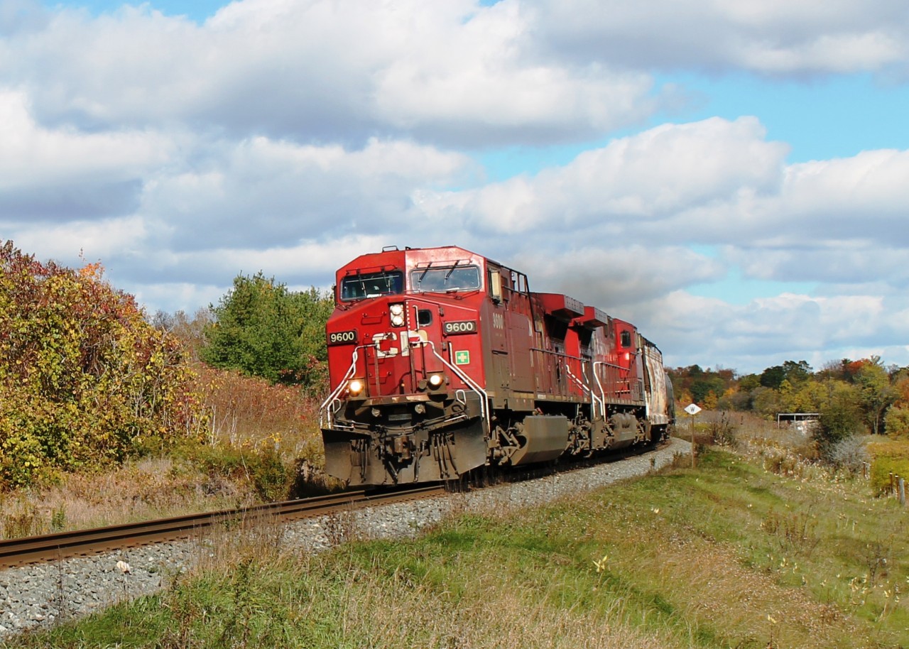 CP 9600 and 8621 lean into the long curve to the east of Ayr around Ayr Pit. The train has just made the climb from Orr's Lake and gaining speed!