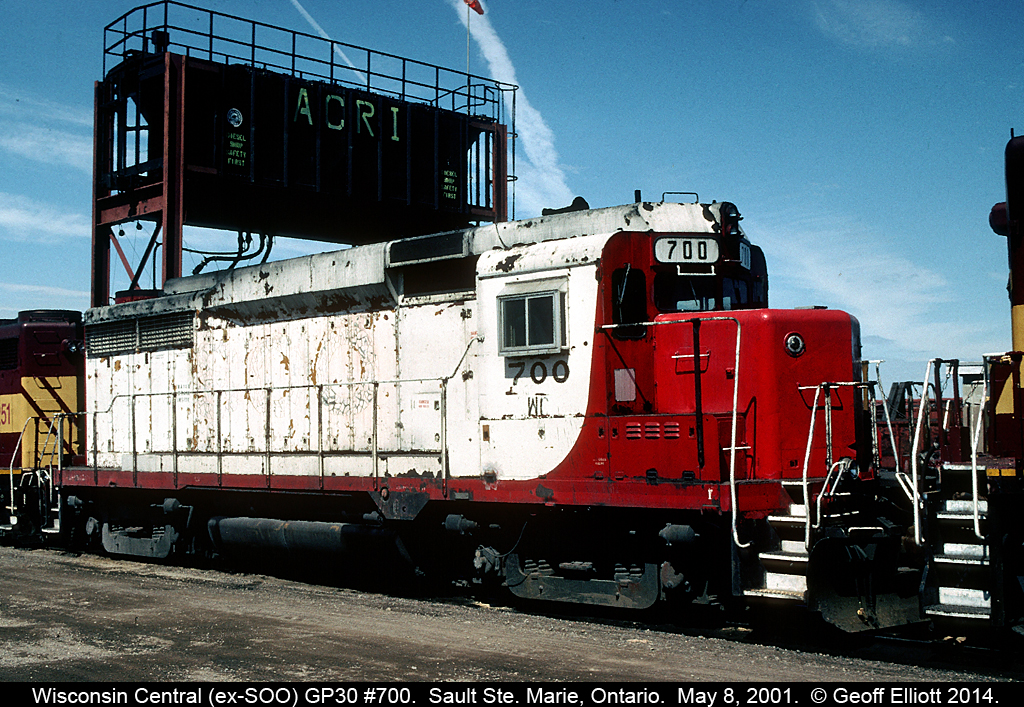 Looking a little worse for wear Wisconsin Central GP30 #700 is the mid-unit of a trio that came into Sault Ste. Marie on the morning of May 8, 2001.  No mistaking the SOO LINE heritage of the unit in this case.  WC 700 later was donated to the Lake Superior Railroad Museum in Duluth, MN and has since been restored to her former SOO Line beauty, but it's hard to believe how bad it looked in 2001.  Here is a link to the 700 working for the Museum to store empty hoppers.... http://www.railpictures.net/viewphoto.php?id=276116&nseq=50