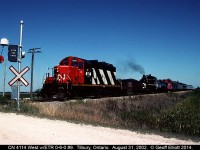 CN 4114 leads the parade as Essex Terminal 0-6-0 #9, and all the support cars, are moved from St. Thomas to Windsor for the 90th Anniversary Celebration on the Essex Terminal Railway.  ETR #9 pulled excursions, utilizing the equipment in tow, on the Essex Terminal for much of the Labor Day Week in 2002 with hundreds of families taking part in riding the train.