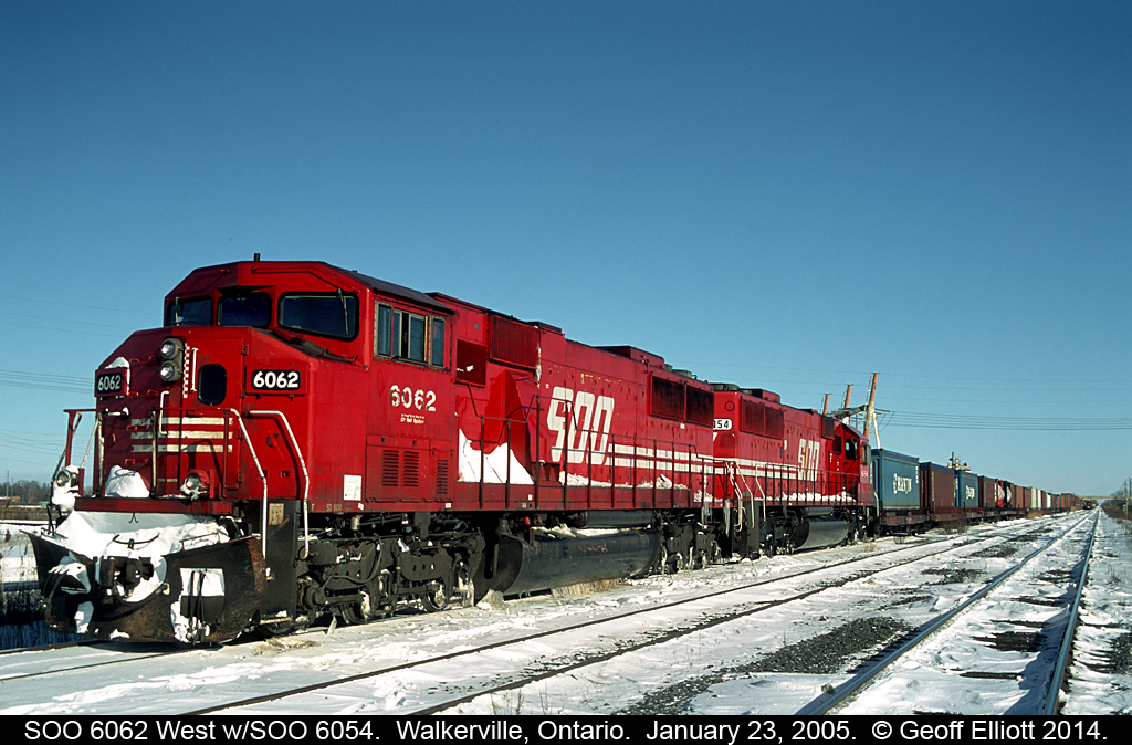 Candy Apple red SOO's adorn this westbound container train as it sits in Walkerville, Ontario on a frigid January 2005 day.  SOO SD60M #6062, with sister SD60 #6054, are frozen to the rails today after sitting in the siding here for a couple of days before being readied to head State side.