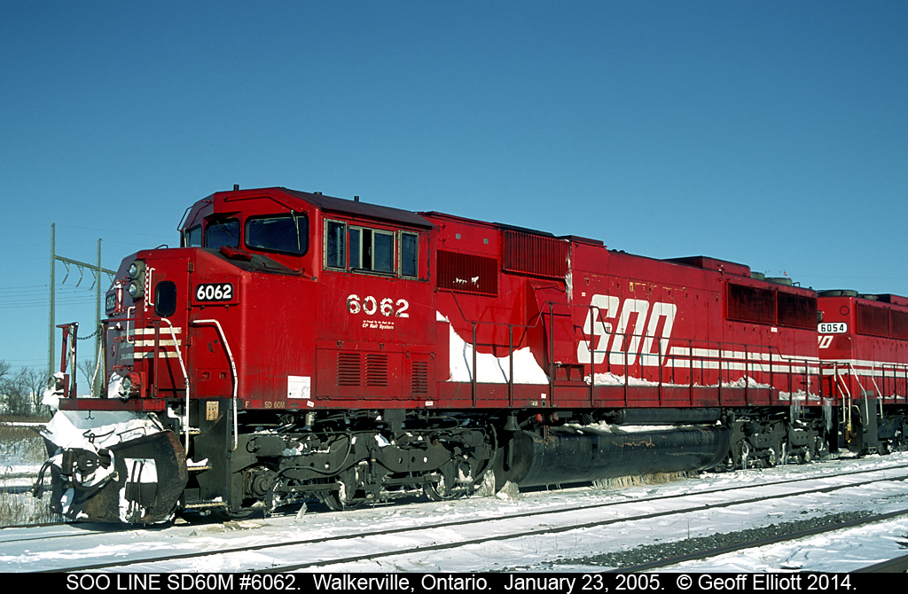 SOO LINE SD60M #6062 is lead on a westbound container train that has been sitting in Walkerville for a couple of days now.  You can see that the temperature has been fluctuating as the fuel tank is frozen to the tracks with icicles!!!