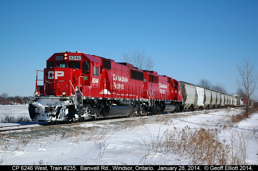 A nice pair of rebuilt SOO SD60's on train #235 today, with 6246 and 6239, glide past Banwell Road as they approach the "Begin/End CTC Walkerville" signal.