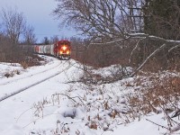 A Chilly first trip of the year for T08 as some of the Ice storm damage lies trackside in Claremont Ontario.