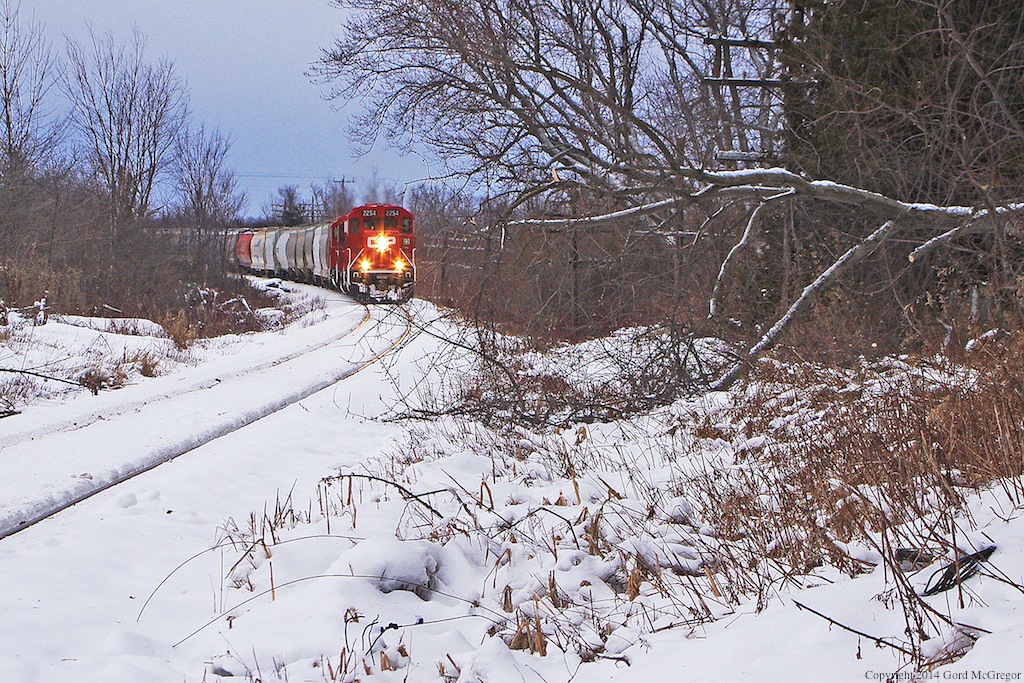 A Chilly first trip of the year for T08 as some of the Ice storm damage lies trackside in Claremont Ontario.
