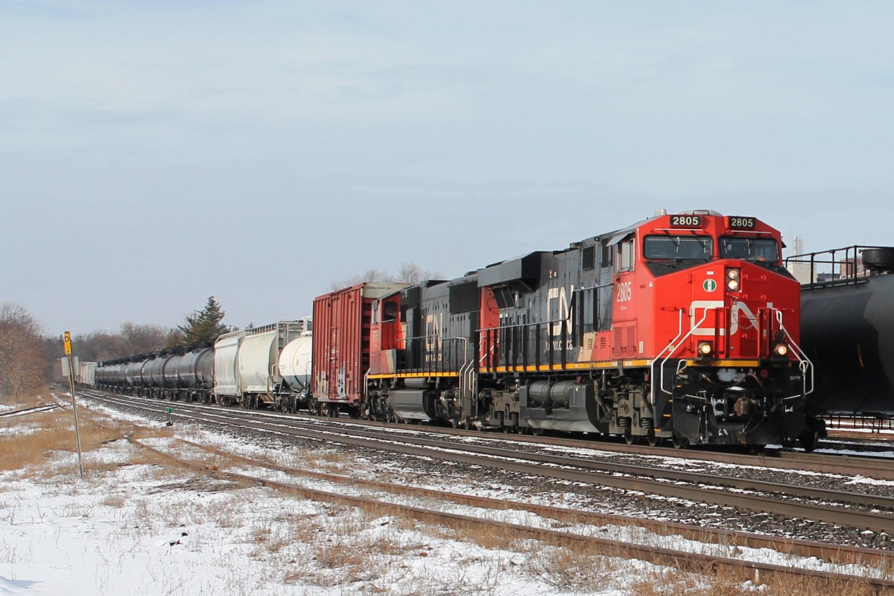 12:46 and this eastbound is pulled by an almost new CN2805 and an older CN 5751. The train caused the following eastbound VIA to be running late!