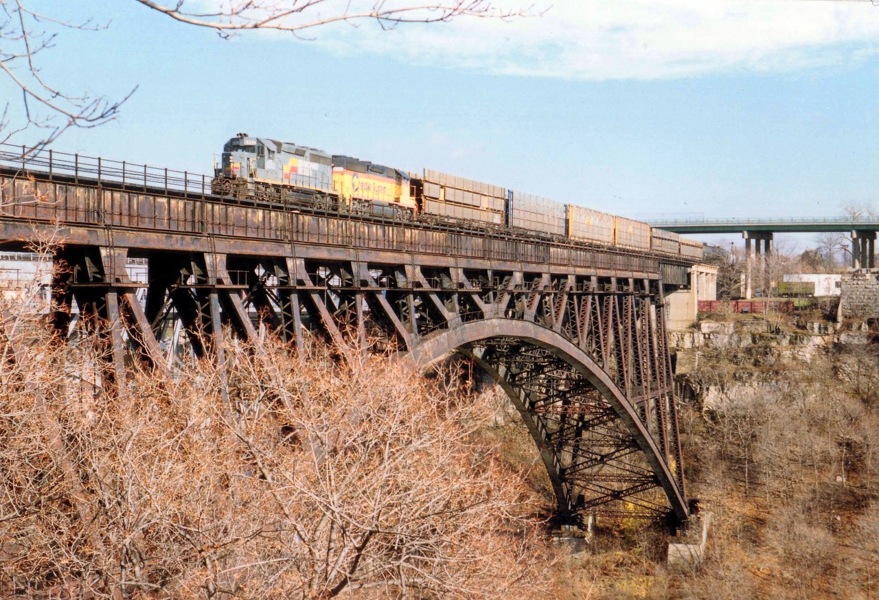 Nice surprise to see a former Seaboard Coast Line, still in SBD paint, leading the #321 over to Canada on an early afternoon run. Needless to say, this was a rare occurrence.  Second unit is CSX 6246.