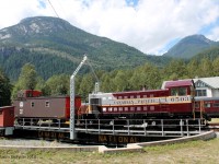 CP 6503, a retired switcher in fresh paint rests on a Canadian National turn table in the outskirts of Squamish, BC under the mountain light.