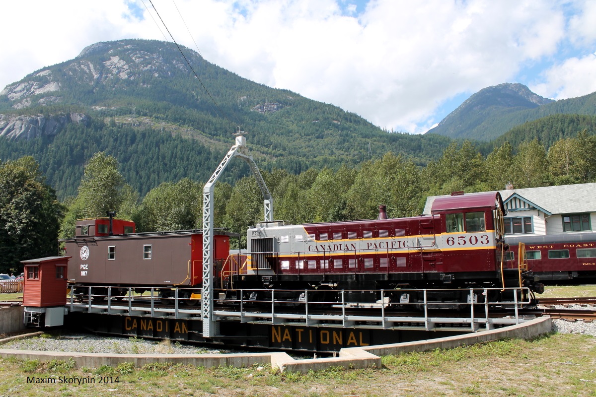 CP 6503, a retired switcher in fresh paint rests on a Canadian National turn table in the outskirts of Squamish, BC under the mountain light.