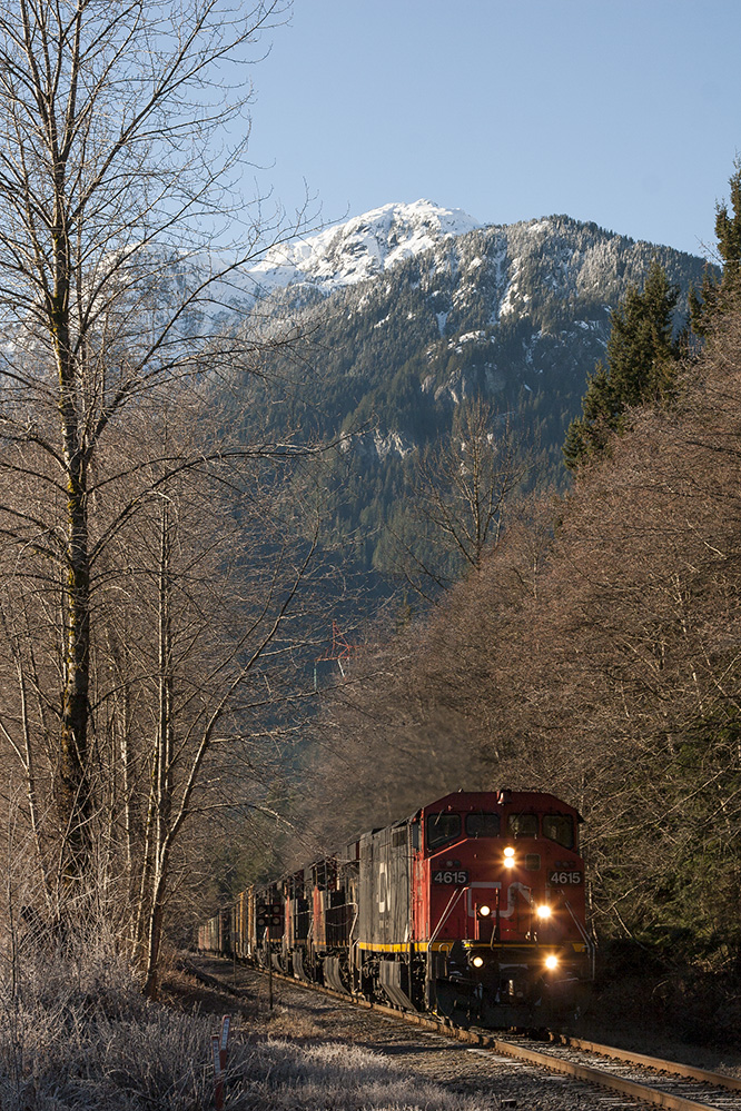Back on home rails, BCR 4615 in CN paint leads the charge on CN 571 as she chugs upgrade though Cheeye enroute to Lillooet for a crew change.
