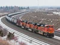 SWOOSH : A trio of BNSF units lead an eastbound crude oil train on the Kingston Sub.
