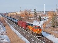 Flying solo, BNSF 4794 West has this empty crude oil train well in hand. 