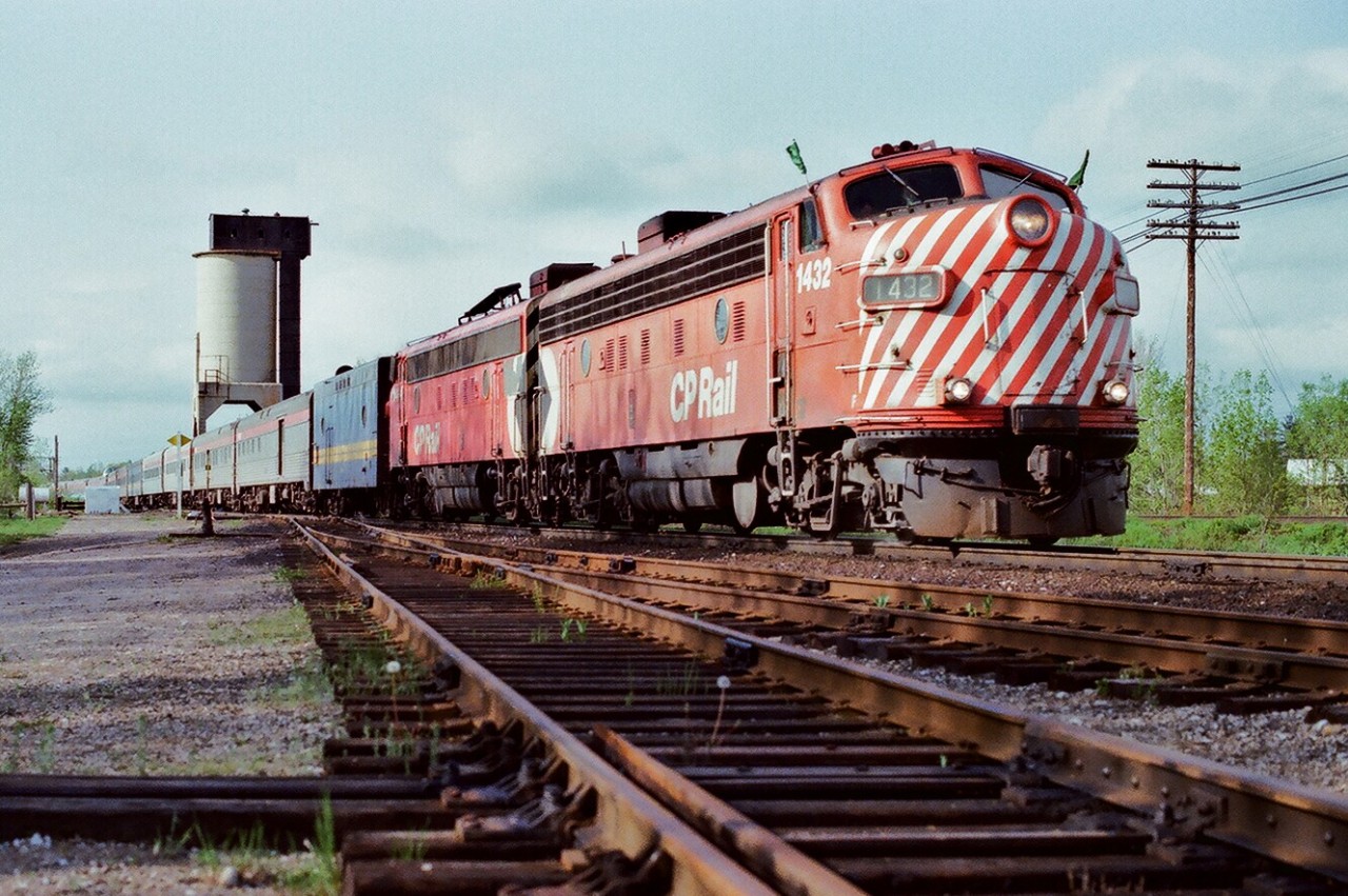 Green Flags !


First #122 glides past the CN Washago coaling tower onto the CN Newmarket Subdivision powered by ….strangers in an foreign land.....ex CP Rail FP9A's 1432 (ex 4041) – 1404


The 1979 re-routing moved the daily VIA transcontinental from CP Rail's Mactier subdivision to the CN Bala and Newmarket subdivisions. The Employee Timetable does not show this train.  In the meantime – until the new Employee Timetable is in effect - First #122 is the re-routed eastbound Transcontinental acquiring those Green Flags at CN Washago for the trip south on the Newmarket Subdivision to Union. The Second Section of Train #122  -  the Northlander - follows in 2 hours. (CN Bala Sub is in the background at right).


May 12, 1979 Kodachrome by S. Danko.


  same day approach CN Washago  


sdfourty