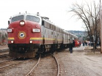 ACR #1 North passenger stopped at Hawk Jct station. Despite the death of the smelter at Wawa, just down the road, and the other assorted blows handed out to the unsuspecting citizens; commerce struggles on. The excitement today, as in most fall days, is centered around the baggage car. Why? Well, if it isn't loaded up with camping equipment and canoes.....and beer, for those heading into the bush, it is loaded with what is so common to us in the South and unavailable in the North. What might that be??  CORN.  Sacks and sacks of corn. Everybody seems to want corn. Corn in the Northern Camps is a delicacy. In Hawk, people anticipated the arrival of the corn like the citizens in days of old awaited the mail. :o) So this day it was 1756 and 1761 to the rescue. Once the Feds kill off this passenger service,(very soon) the favourite amongst the crowds will come by truck at probably 6 or 7 times the cost. And no way to get it to the people.