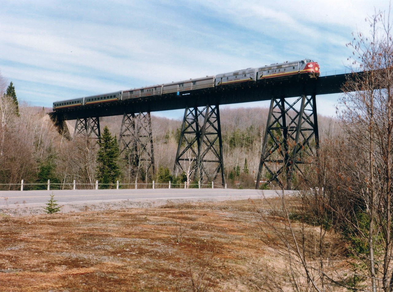 Southbound ACR passenger #2 with ACR 1761 and 1756 provides the power as seen rolling over the Bellevue Trestle; (located roughly half way between Heyden and Searchmont) this pleasant spring morning. It has been announced that the federal government, in another miserable move contradicting how they claim to "aid Northern development", is pulling out support for this lifeline passenger service, effective the end of March 2014. One wonders what those living along this isolated line are going to maintain a link with the outside world. So, effective very soon, images of this nature will be no longer possible. The only activity left will be the daily CN freight and the Agawa Canyon Tour train.