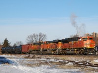 CN U71091-21 makes it's way through Brantford with BNSF 9255, BNSF 6031 and BNSF 4462 leading 99 cars (1 buffer + 97 tanks + 1 buffer)