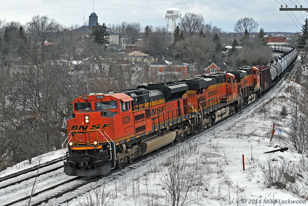 CN crude oil train 710 snakes through the town of Napanee behind BNSF 9206, 7225, and 6687. 1509hrs.