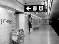 <i>"Time is a train,<br> Makes the future the past.<br> Leaves you standing in the station,<br> Your face pressed up against the glass."<br> - U2, Zoo Station</i><br><br>  Waiting for the next train - just a stop down the line. 1960's bathroom ceramic tiled Bathurst Subway Station during evening rush hour.