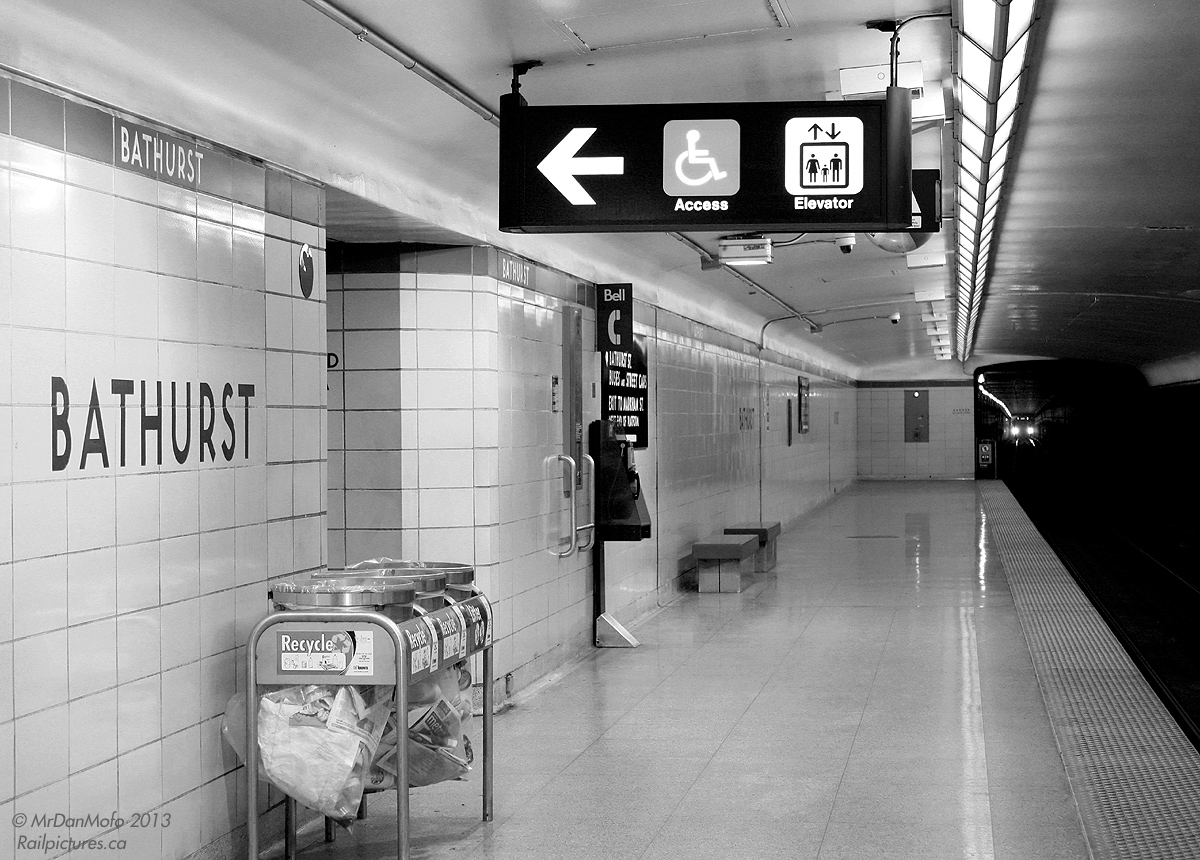 "Time is a train, Makes the future the past. Leaves you standing in the station, Your face pressed up against the glass." - U2, Zoo Station  Waiting for the next train - just a stop down the line. 1960's bathroom ceramic tiled Bathurst Subway Station during evening rush hour.