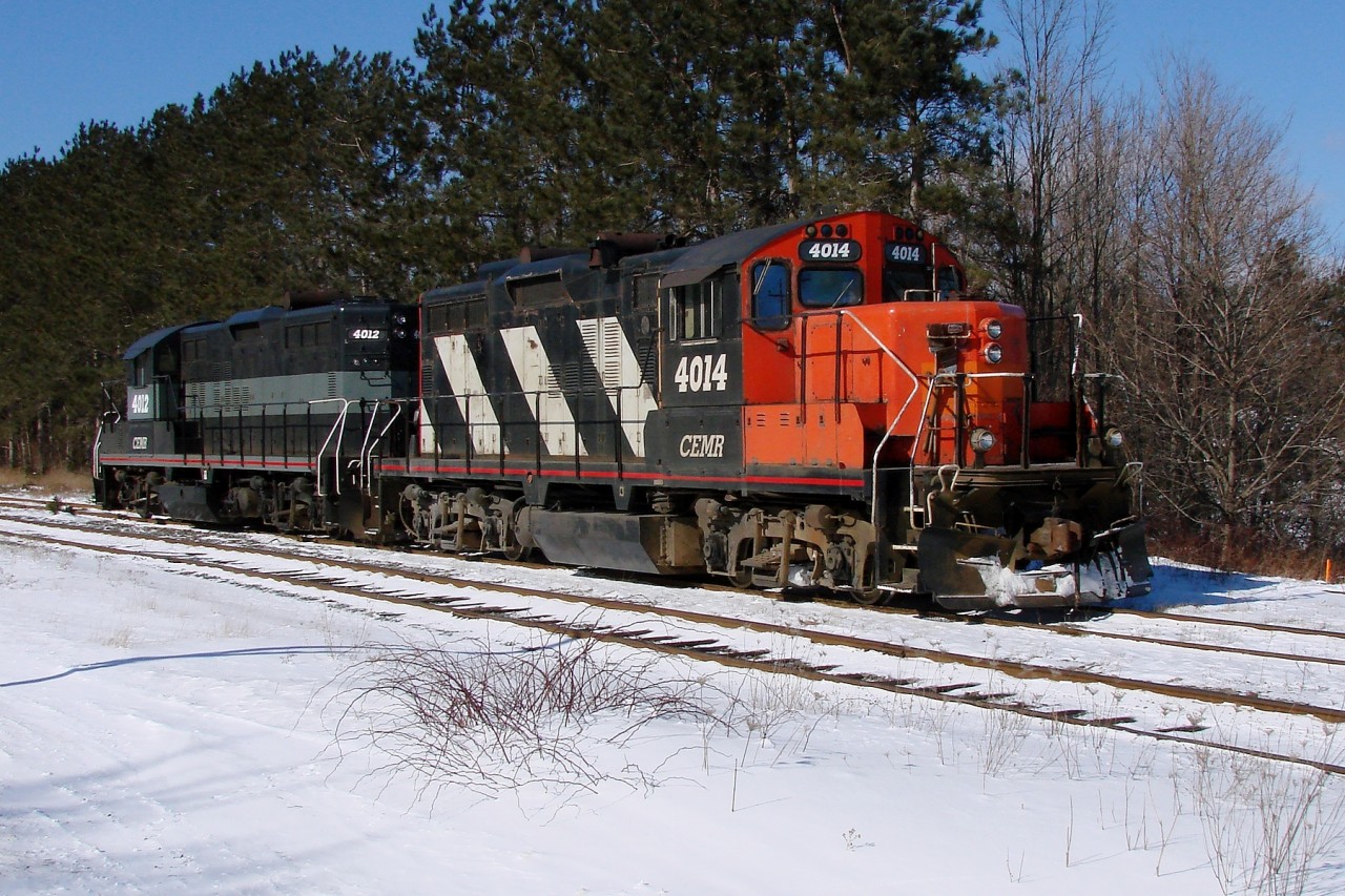 Leased CEMR GP9's 4014 and 4012 head to the end of the yard after dropping off a loaded gypsum train.
