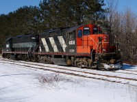 Leased CEMR GP9's 4014 and 4012 head to the end of the yard after dropping off a loaded gypsum train.