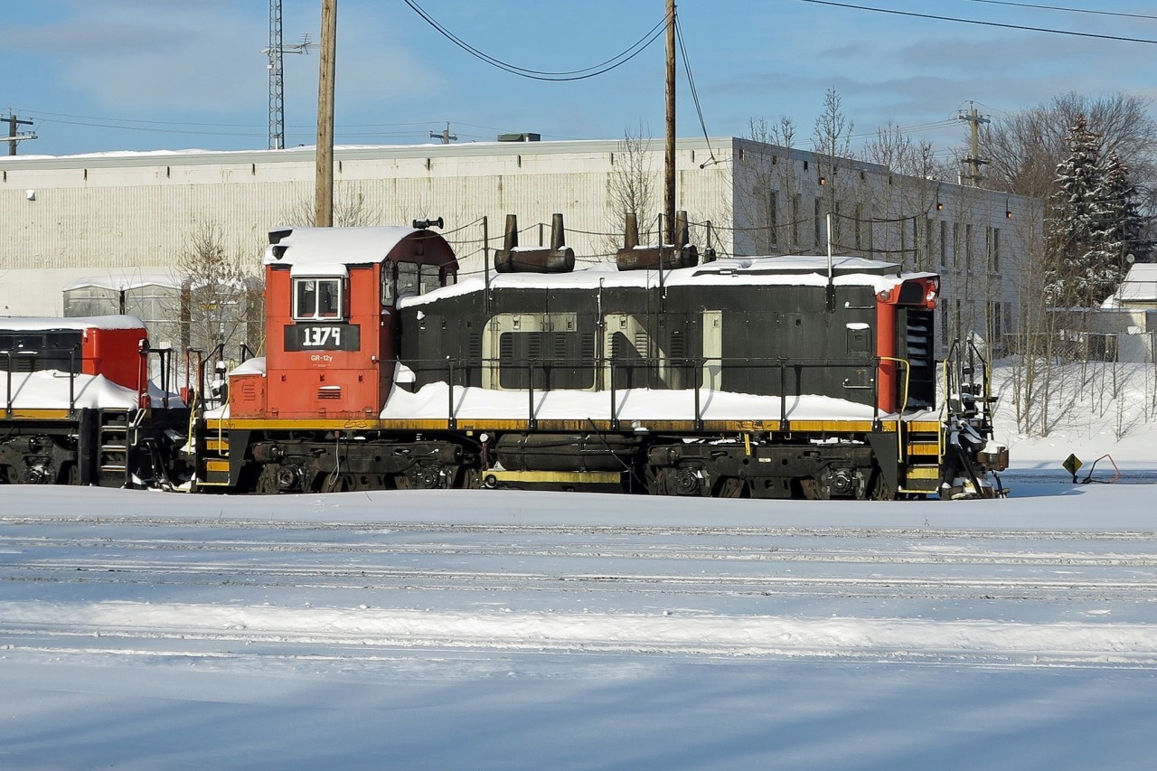 CN SW1200RS 1379 parked at CN's Walker Yard. This locomotive was originally retired in 1999 and then renumbered CS02 and used as a shop switcher.