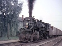 Canadian National 3505, a 2-8-2 "Mikado", heads westbound past the platform at CN's Clarkson Station (located by Clarkson Road, east of the current GO station and freight yards) in 1957.