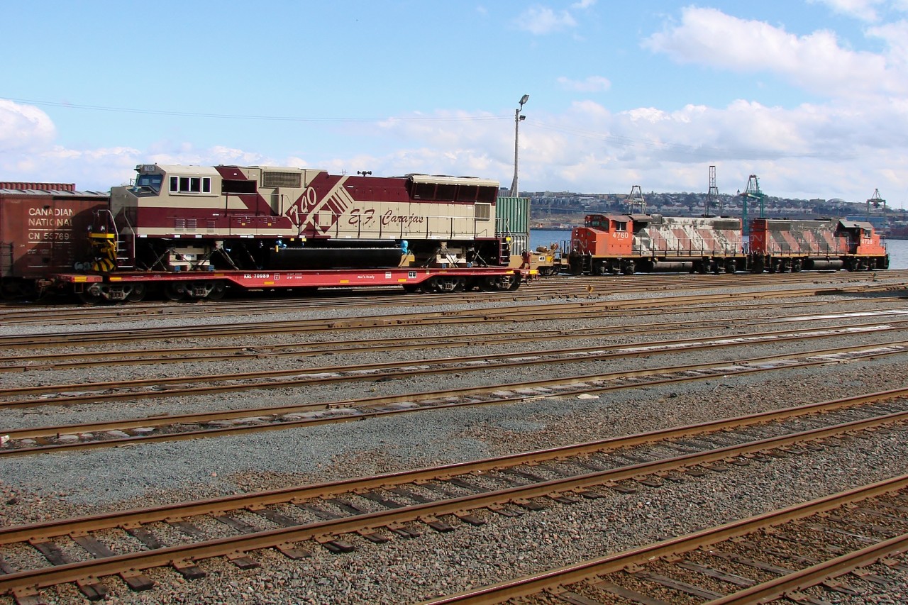 CN 4760 and 4724 work Rockingham Yard while broad guage EFC - Estrada de Ferro Carajás SD70M 740 waits to be delivered to Halifax Ocean Terminal Yard for shipment to Brazil.