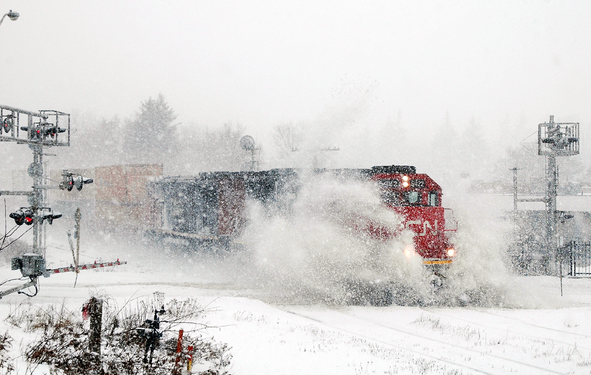 Who You Gonna Call? CN 394, with CN 5422 - CN 2449 and 89 cars in tow busting a drift at Hardy Road.